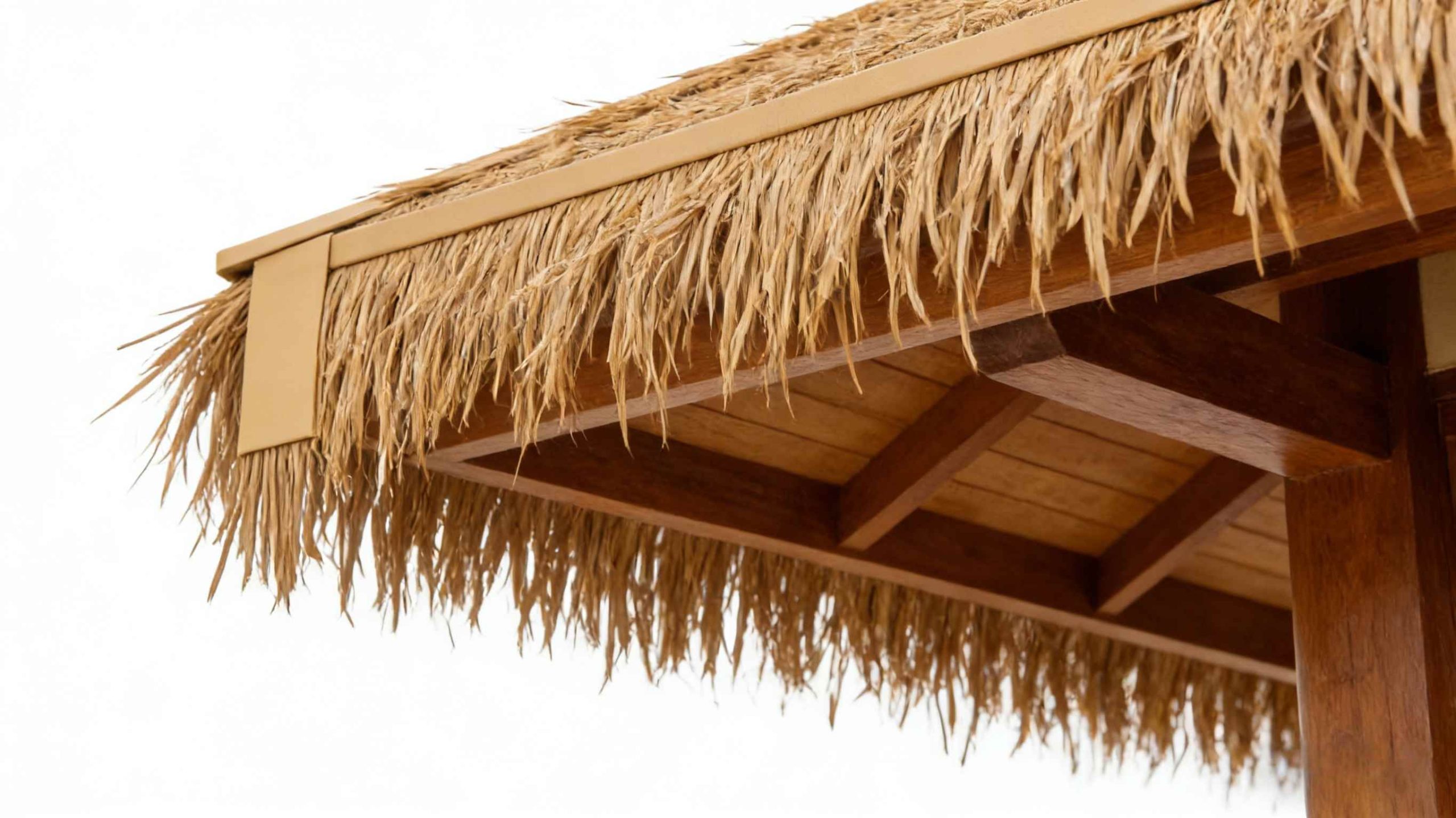 Close-up of faux thatch roofing using synthetic straw thatch on a resort eave
