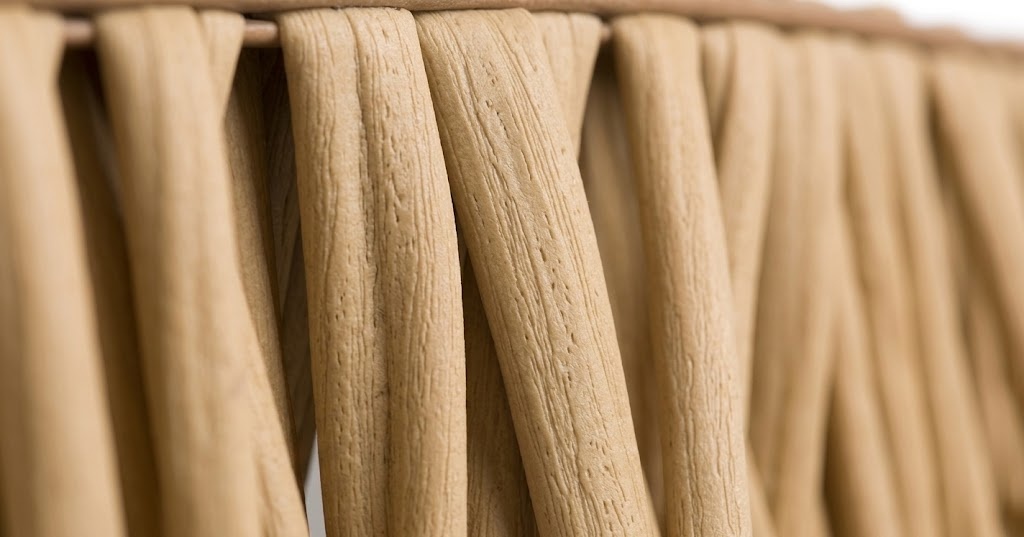 Macro close-up of the realistic texture on synthetic nylon straw thatch made of modified HDPE.