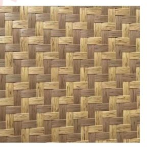 Close-up view of a synthetic bamboo woven mat texture, featuring an intricate two-tone geometric pattern of interweaving light beige and medium brown strips.