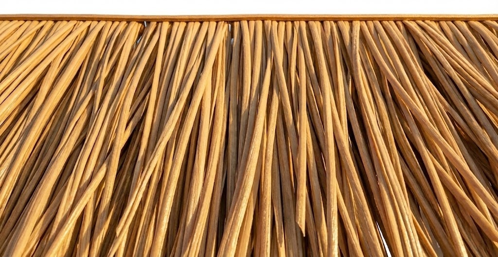 Bright sunlight shining on UV-resistant Synthetic Nylon Straw thatch panel, showing no color fading.